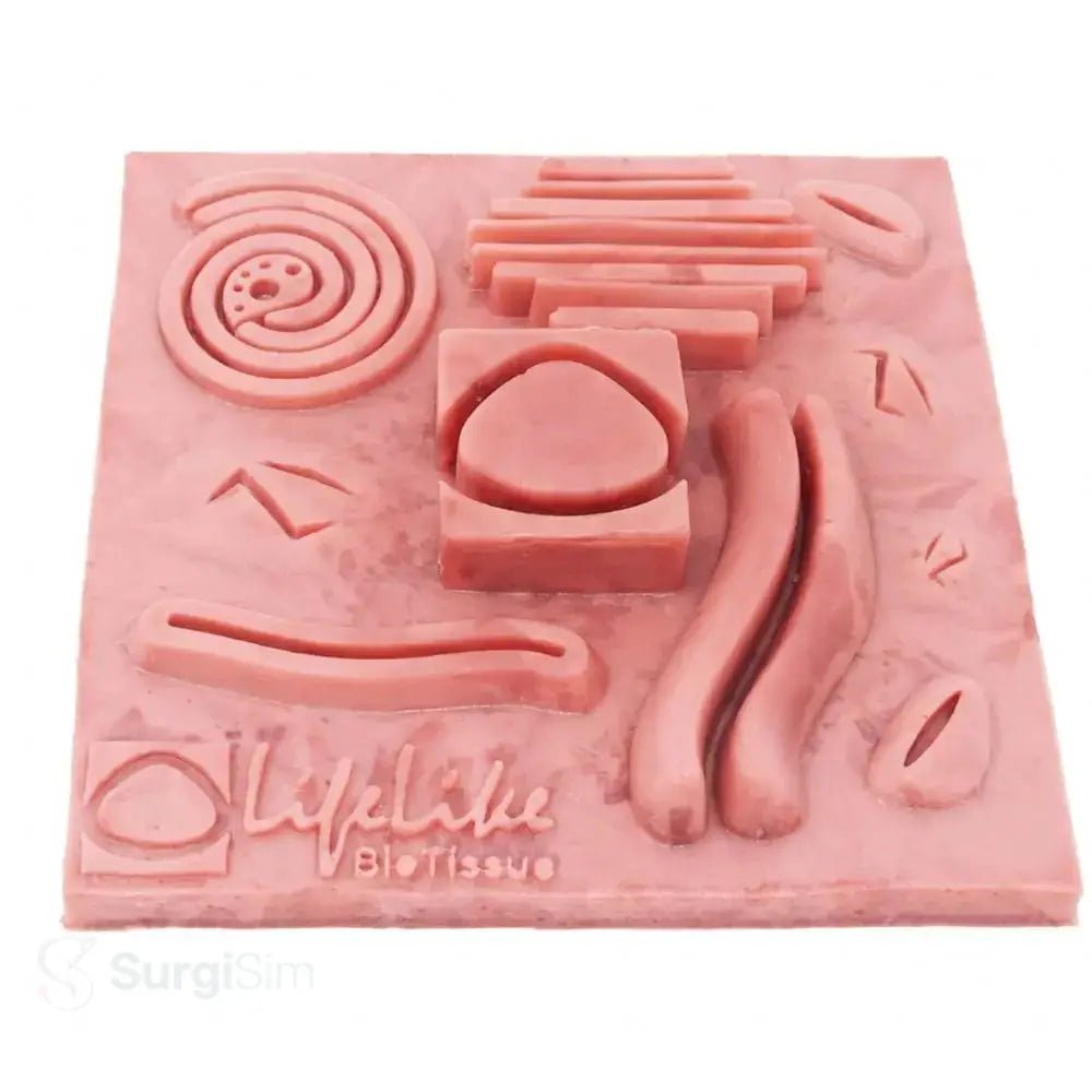 Soft tissue suturing training pad