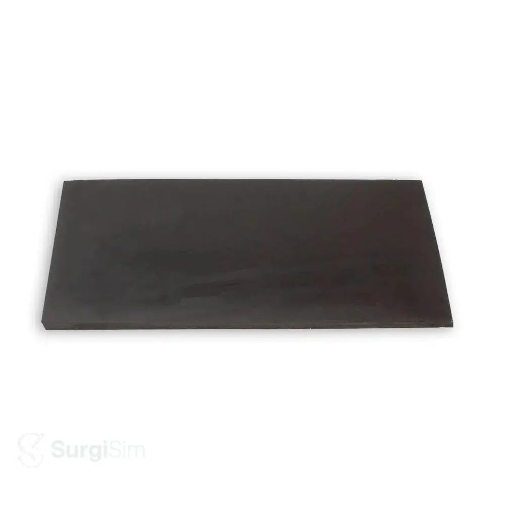 Black rectangular surgical sponge tissue mounting pad for anastomosis practice in surgical skills laboratories